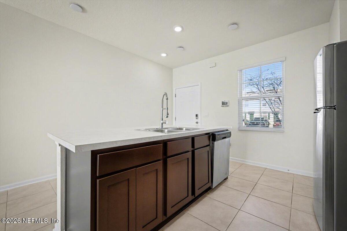 8212 Larose Road Jacksonville, FL 32211 - Photo 10 of 32 a kitchen with a sink and cabinets