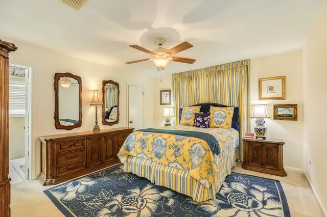 a bed room with a bed and a chandelier