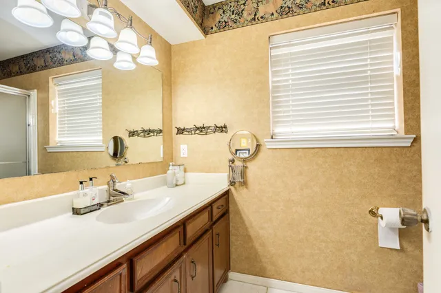 a bathroom with a sink and a mirror