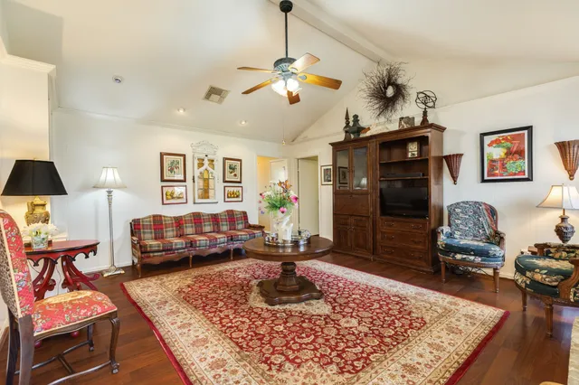 a living room with furniture rug and window