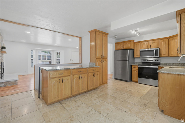 392 Perrine Drive Midvale, UT 84047 - Photo 8 of 37 Kitchen oversee to living room