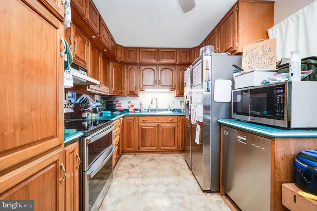 a bathroom with a sink toilet and window