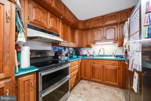 a bathroom with a sink a toilet and a window