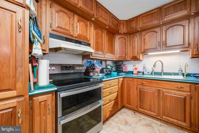 a bedroom with furniture and a flat screen tv