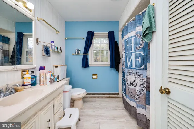 a bed room with a bed and a tv