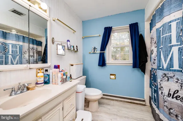 a bedroom with a bed and flat screen tv