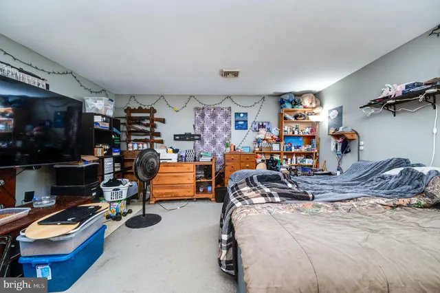 a bedroom with a bed and cabinets