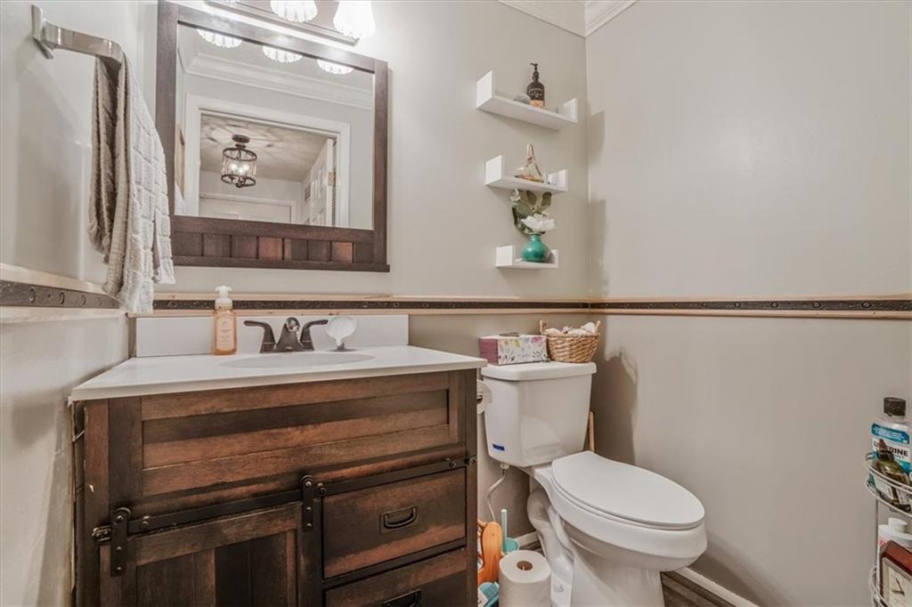 203 Green Court Pittsburgh, PA 15234 - Photo 14 of 38 a bathroom with a toilet sink and mirror