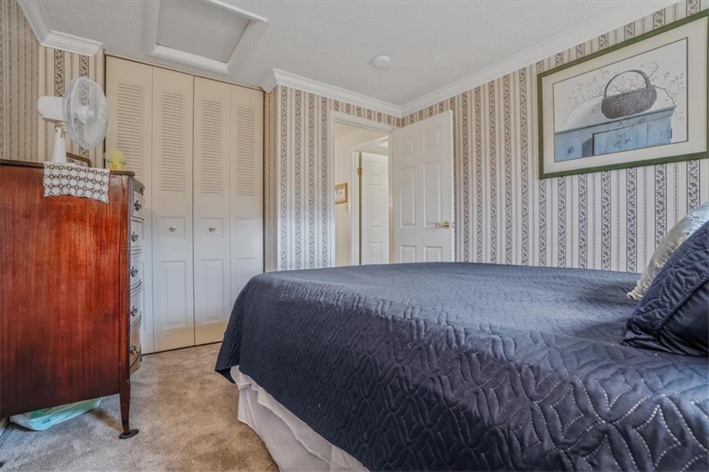 203 Green Court Pittsburgh, PA 15234 - Photo 20 of 38 a bedroom with a bed and a painting on the wall