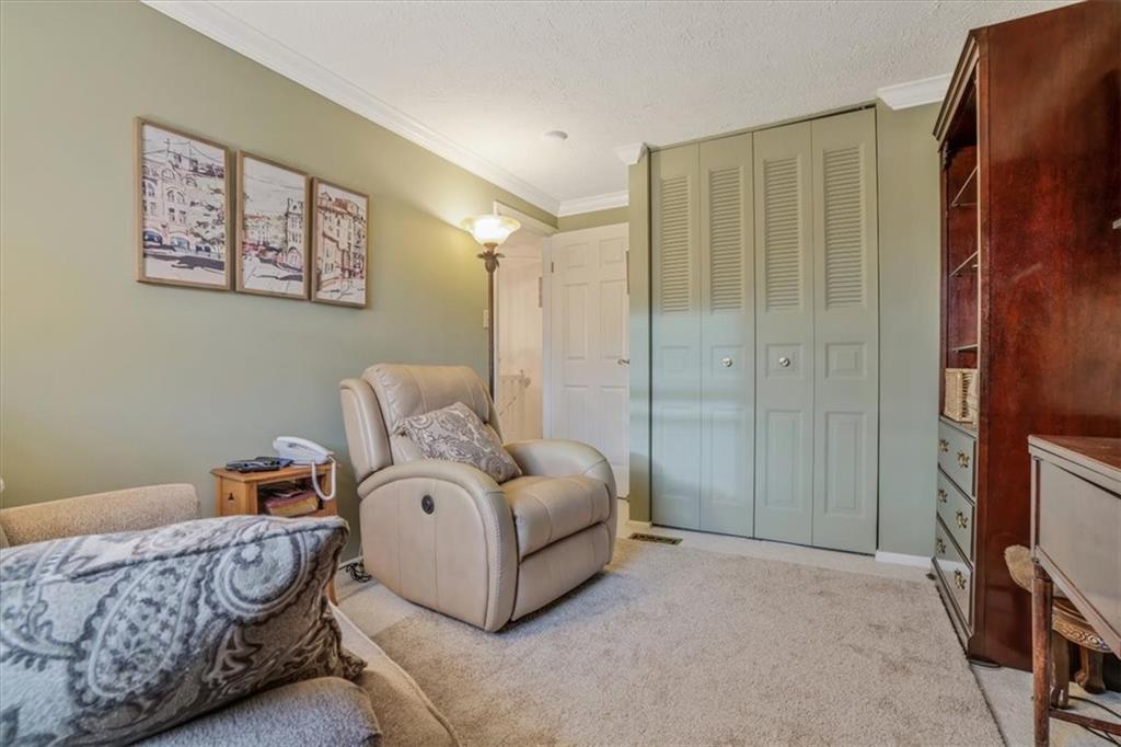 203 Green Court Pittsburgh, PA 15234 - Photo 23 of 38 a spacious bedroom with a bed and a window