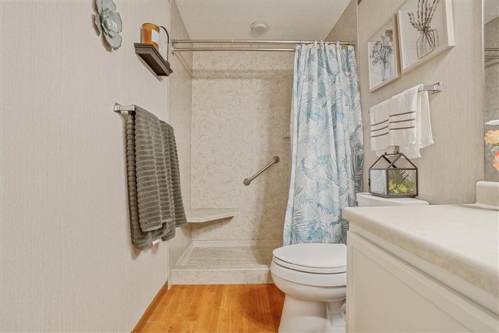 203 Green Court Pittsburgh, PA 15234 - Photo 25 of 38 a bathroom with a granite countertop sink a toilet and shower
