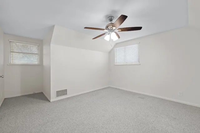 a house that has a tree in front of it