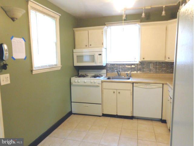 3002 Dunbrin Road Baltimore, MD 21222 - Photo 11 of 30 a utility room with cabinets washer and dryer