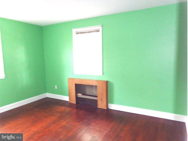3002 Dunbrin Road Baltimore, MD 21222 - Photo 19 of 30 a view of room with window and hardwood