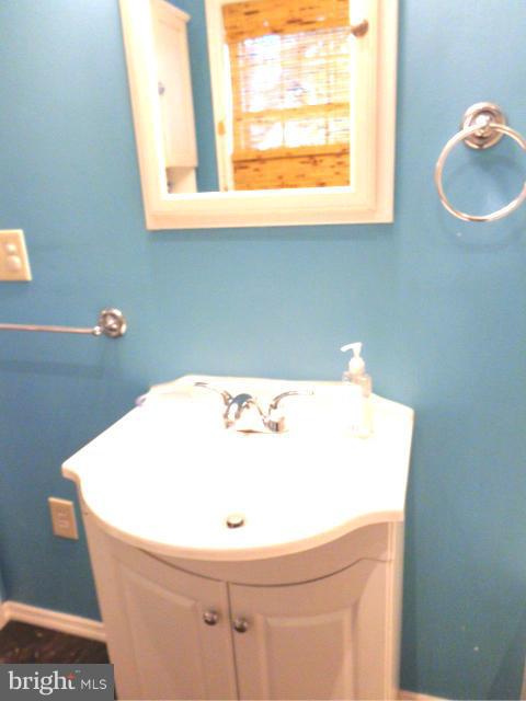 3002 Dunbrin Road Baltimore, MD 21222 - Photo 10 of 30 a bathroom with a sink and a window