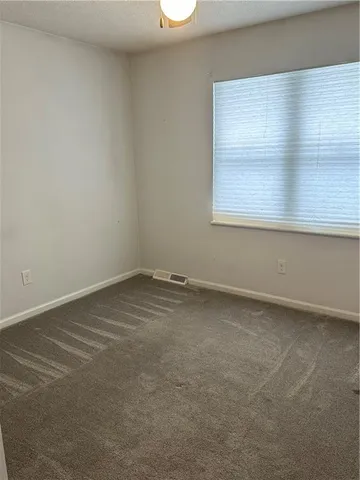 a view of a window in an empty room