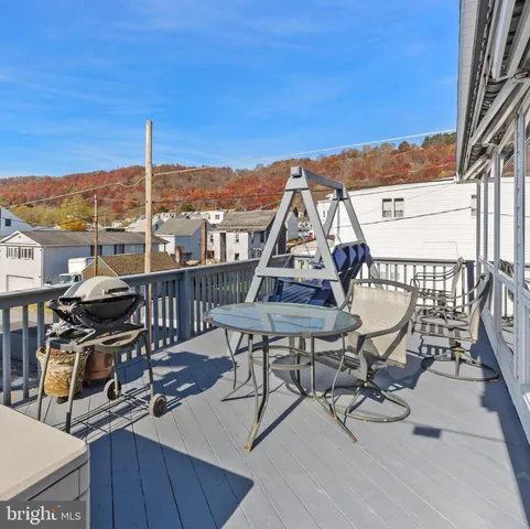 a view of a balcony with chairs