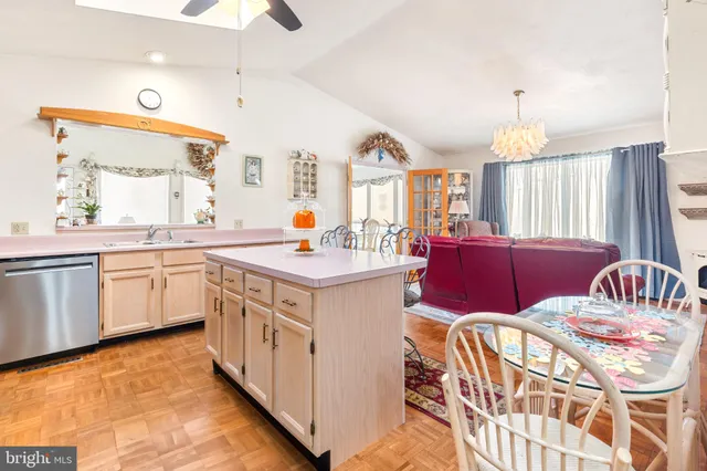 a kitchen that has a lot of windows in it