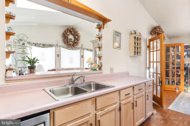 a kitchen with a sink and a window