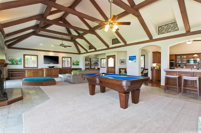 a room with furniture and pool table