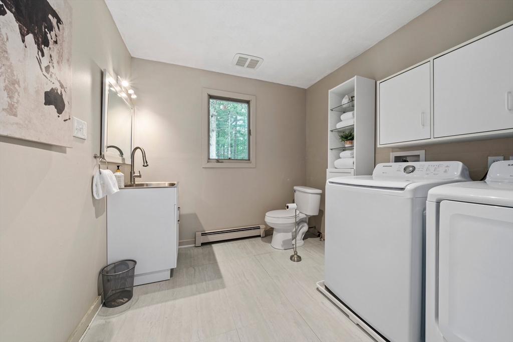 31 Dedham Street Sharon, MA 02067 - Photo 20 of 42 a bathroom with a sink and a mirror