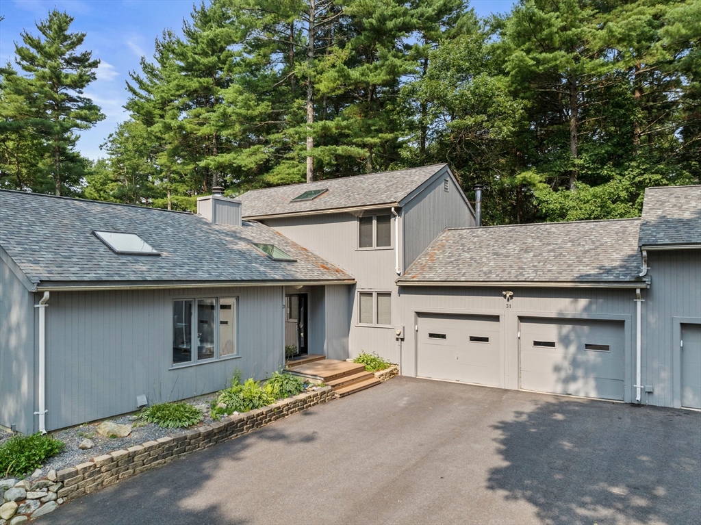 31 Dedham Street Sharon, MA 02067 - Photo 2 of 42 a view of house with outdoor space and a car parked in front of it