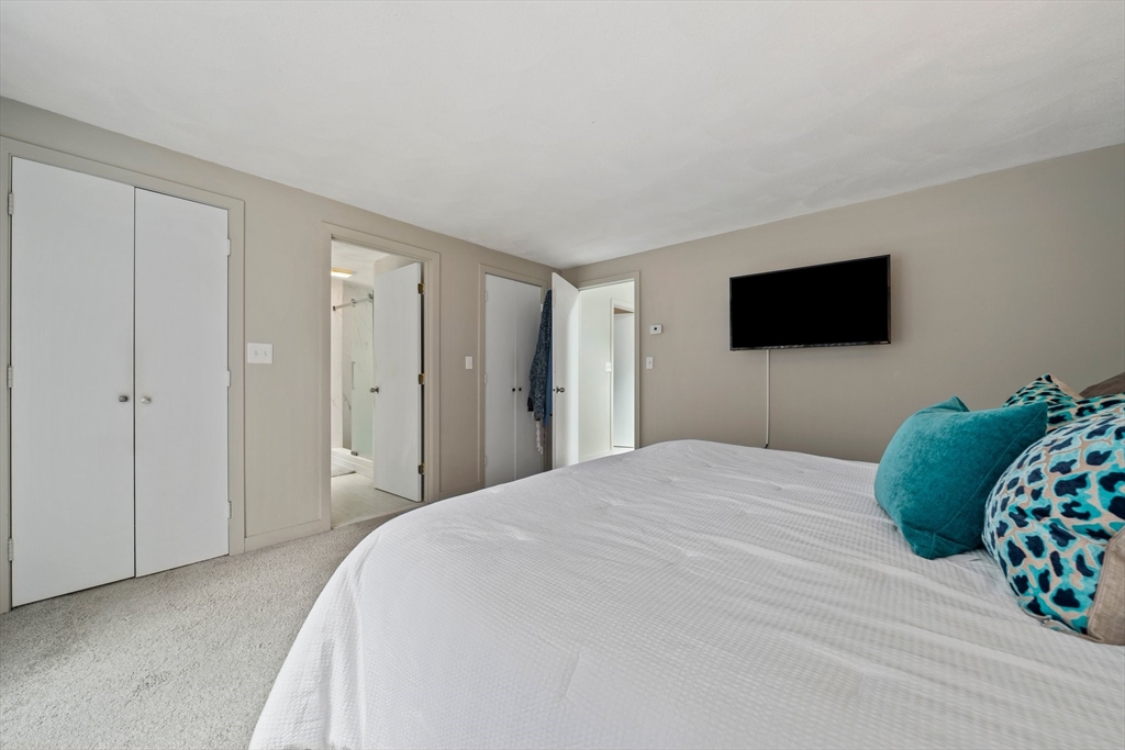 31 Dedham Street Sharon, MA 02067 - Photo 25 of 42 a bedroom with a bed and a flat screen tv