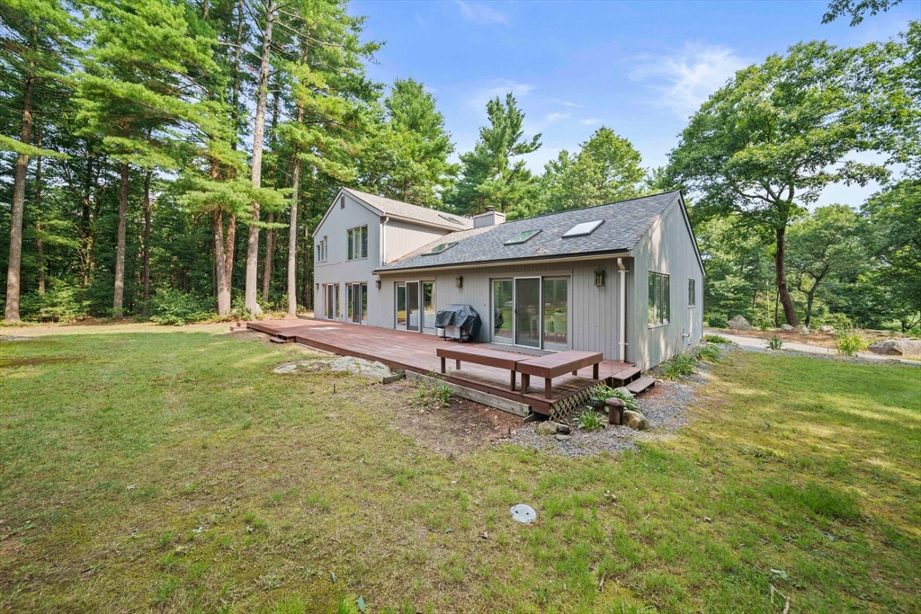 31 Dedham Street Sharon, MA 02067 - Photo 30 of 42 a view of a house with a yard and sitting area