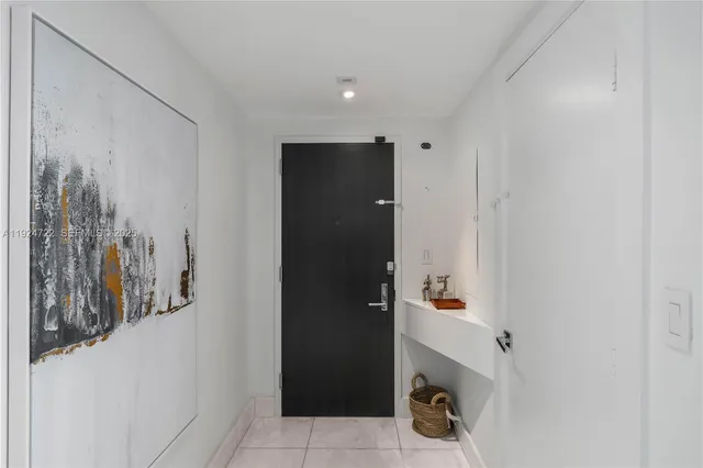 a bathroom with a shower and a sink