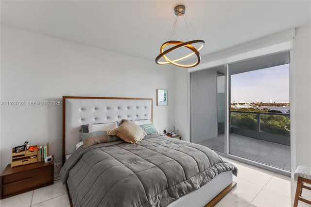 a bedroom with a bed and ceiling fan