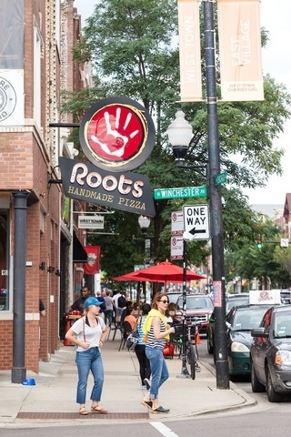 1543 West Augusta Boulevard, Unit 2 Chicago, IL 60642 - Photo 20 of 21 a group of cars parked in front of building