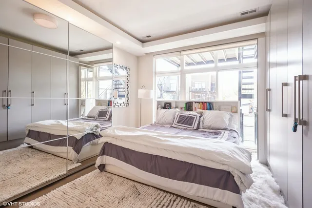 a bed room with a bed and a table