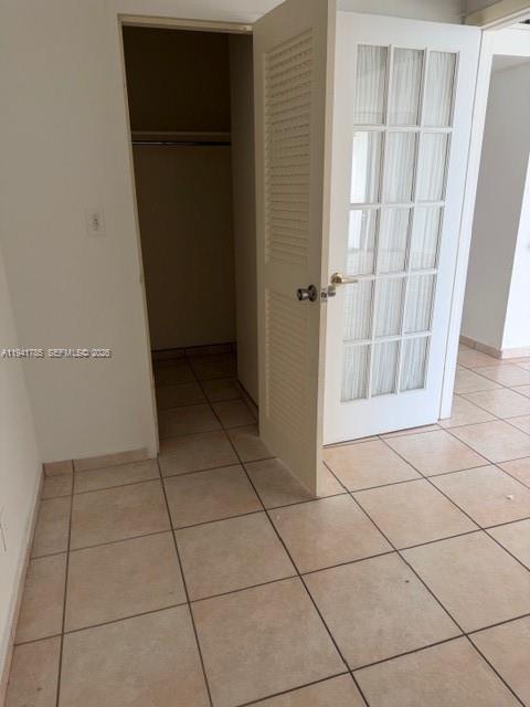 5601 Collins Avenue, Unit 607 Miami Beach, FL 33140 - Photo 12 of 22 a view of a livingroom with an empty space and a glass door