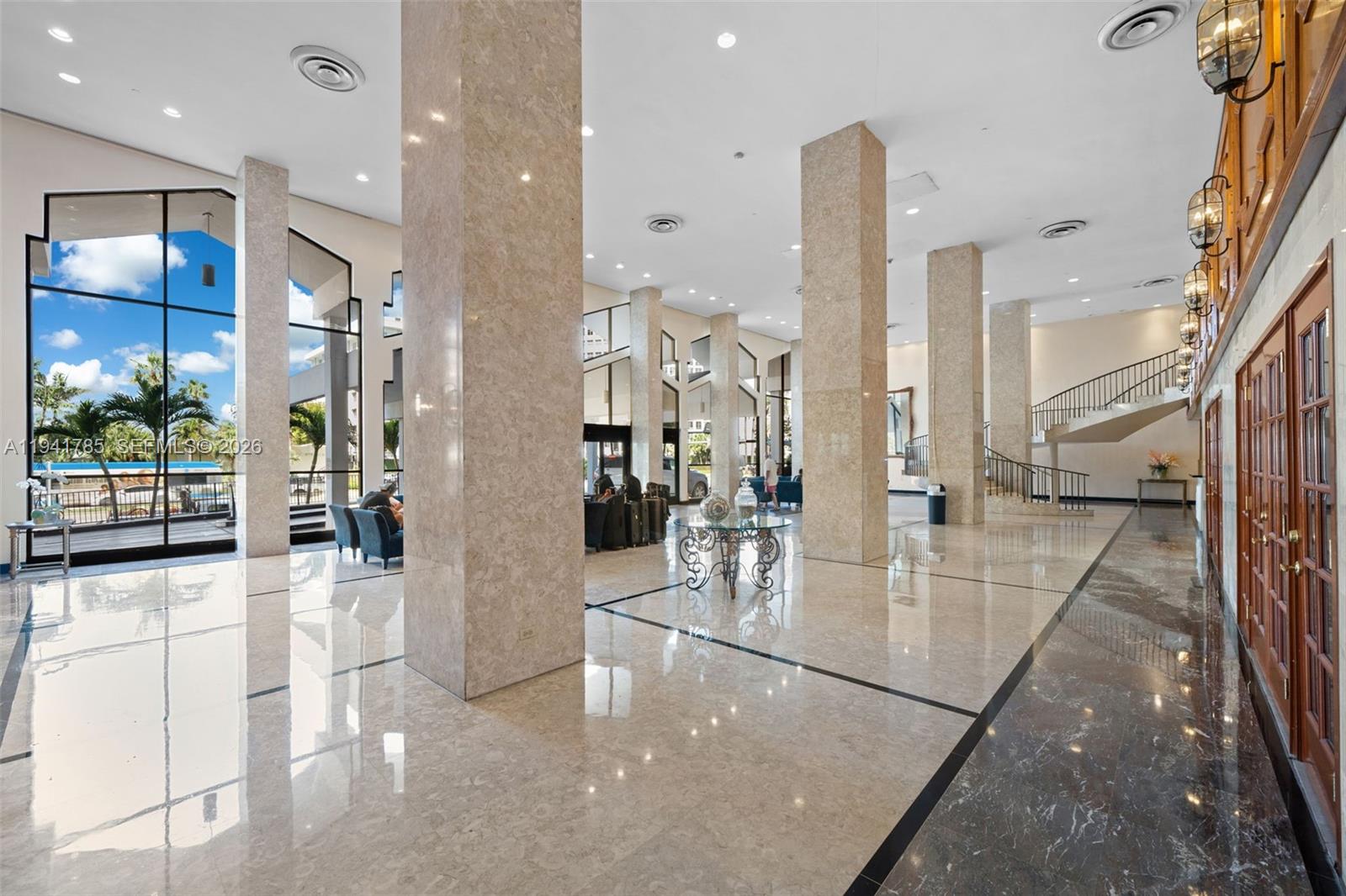 5601 Collins Avenue, Unit 607 Miami Beach, FL 33140 - Photo 2 of 22 a view of a living room and dining room