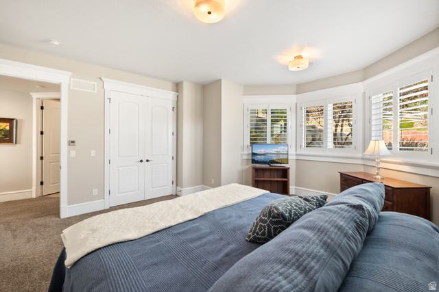 1205 North Elk Rdg Lane, Unit 202 Alpine, UT 84004 - Photo 39 of 88 Carpeted room featuring a bay window with plantation shutters, double closet doors, and recessed ceiling lighting