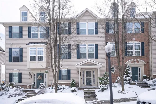 a front view of a building with many windows
