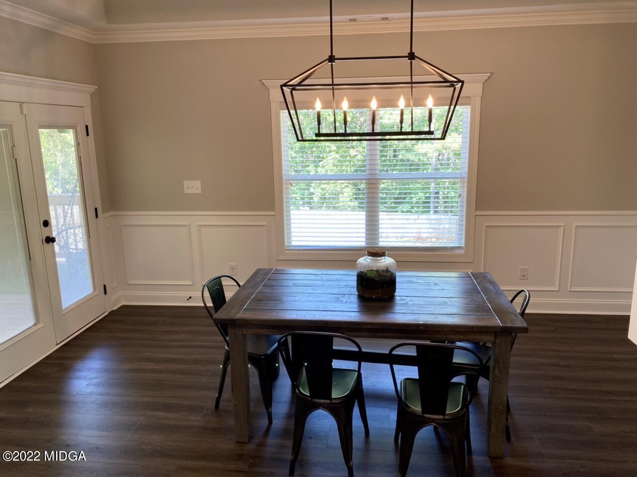 101 Carters Way Forsyth, GA 31029 - Photo 10 of 28 a view of a dining room with furniture window and wooden floor