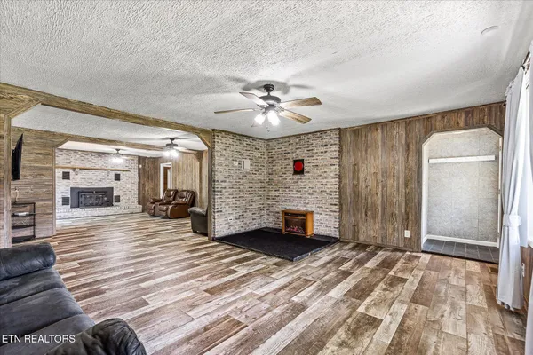 a kitchen with a sink a refrigerator and cabinets