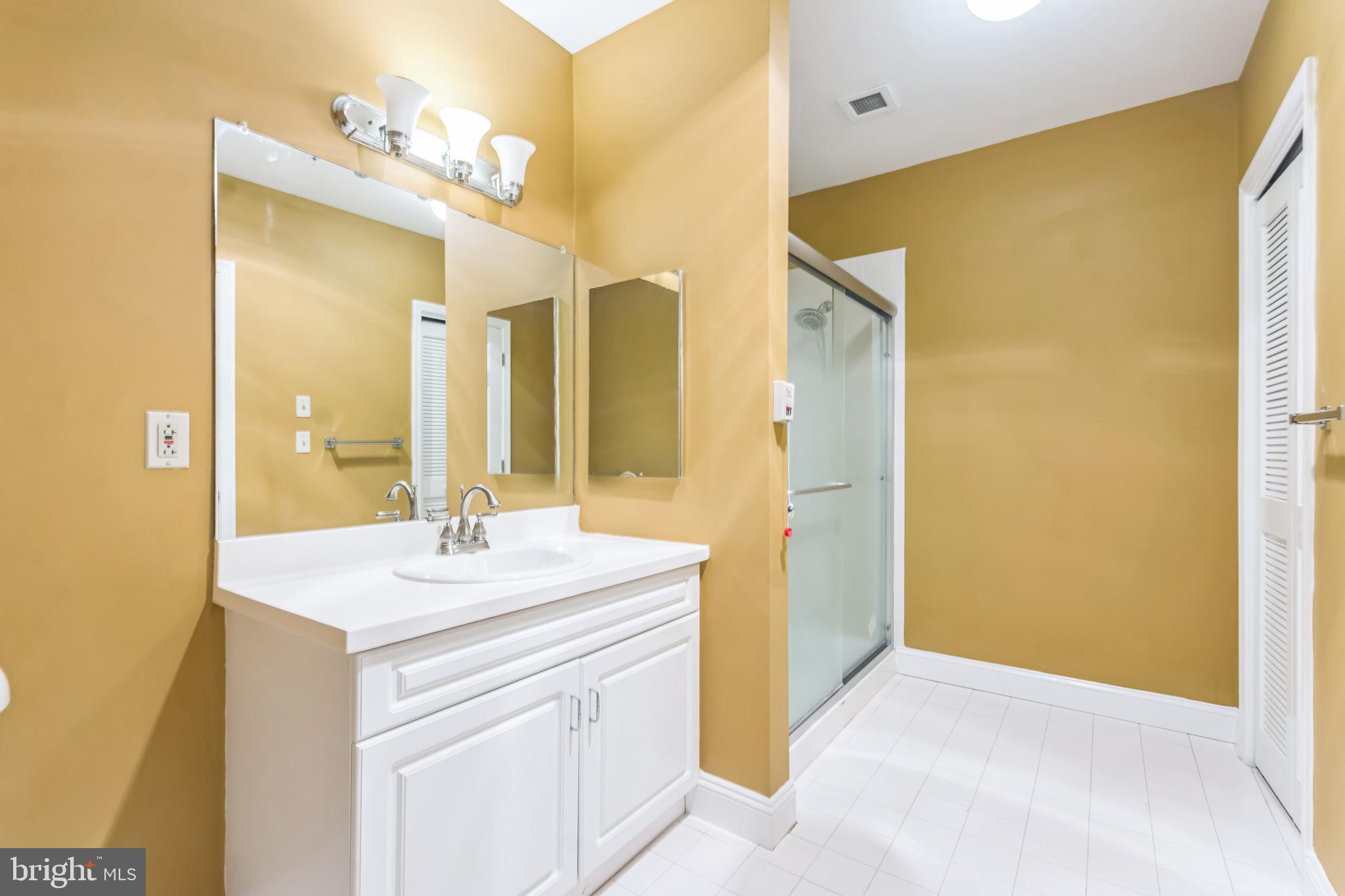 2015 Windrow Drive Princeton, NJ 08540 - Photo 12 of 35 a bathroom with a sink mirror and a shower