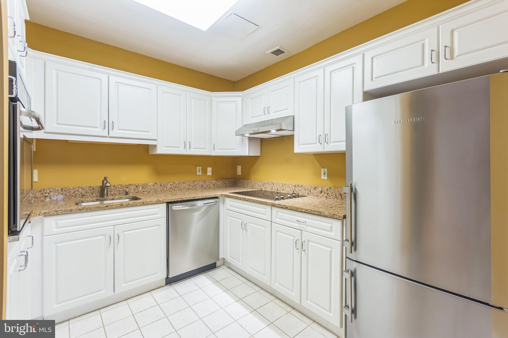2015 Windrow Drive Princeton, NJ 08540 - Photo 6 of 35 a kitchen with stainless steel appliances granite countertop a refrigerator sink and white cabinets