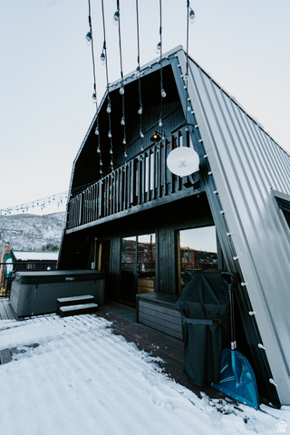 1413 Basel Drive Midway, UT 84049 - Photo 104 of 137 Snow covered house with a gambrel roof and a metal roof