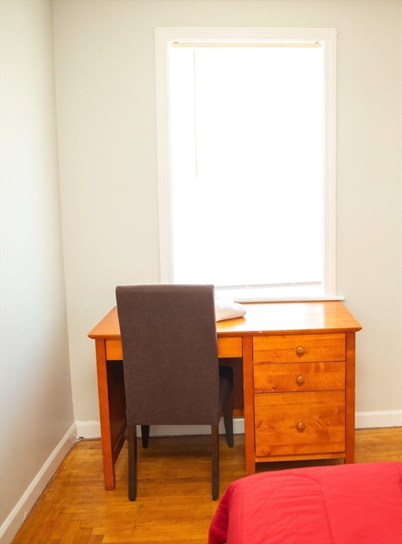 255 Columbia Street, Unit 2 Fall River, MA 02721 - Photo 11 of 15 a room with a table and a chair