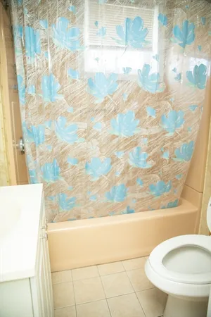 a bathroom with a bathtub and toilet