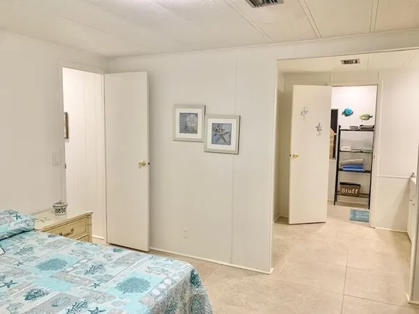 a view of livingroom with hardwood floor and bedroom