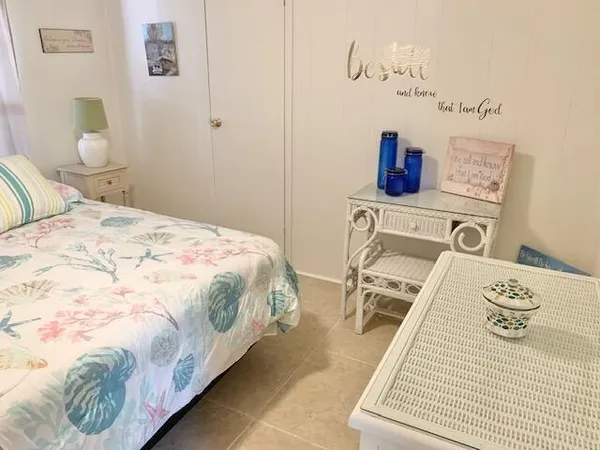 a view of a room with wooden floor and a wall