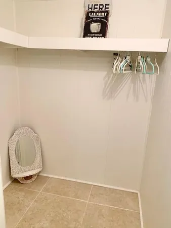 a bedroom with a bed and a desk