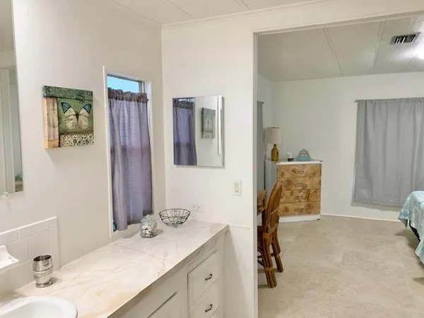 a bathroom with a toilet and a mirror
