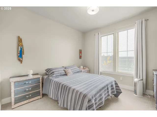 a bathroom with a sink mirror and a toilet