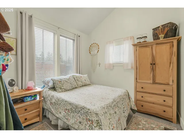 a view of a backyard with fence