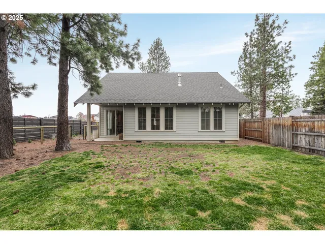 a view of a house with a yard and garage